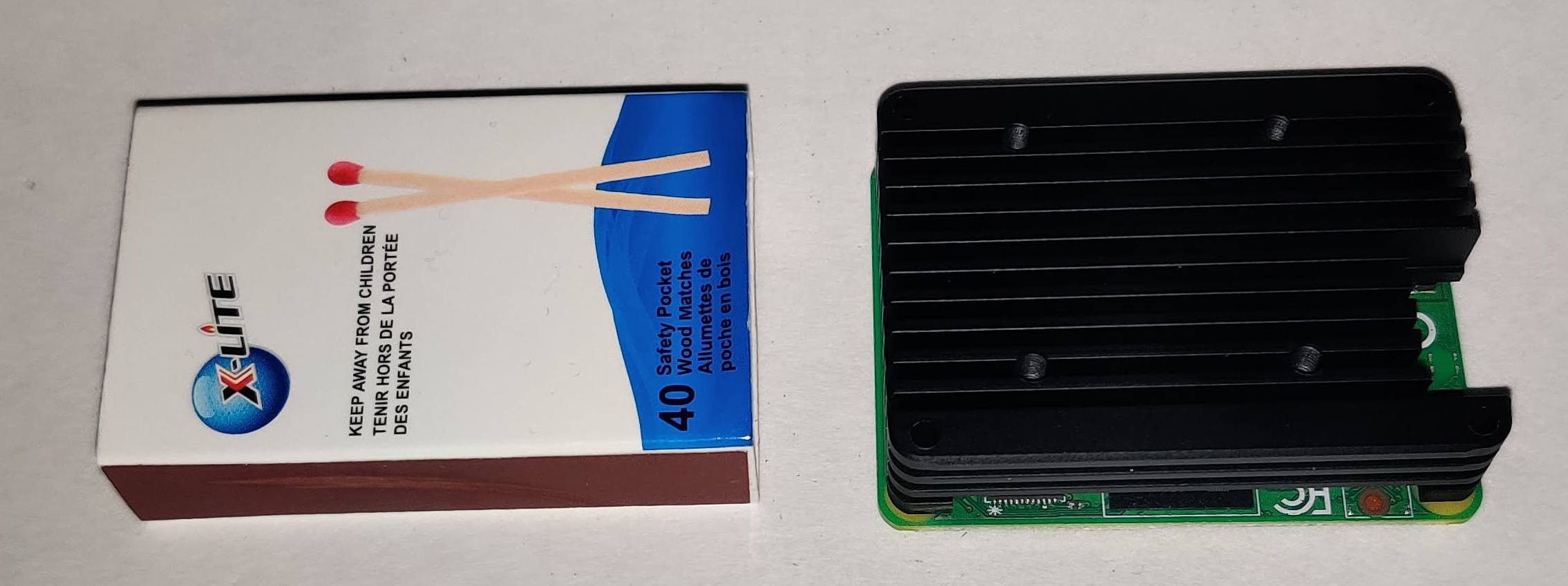 12mm Aluminum Alloy Heatsink (C235) on top of a Raspberry Pi Compute Module 4 with matchbox for comparison